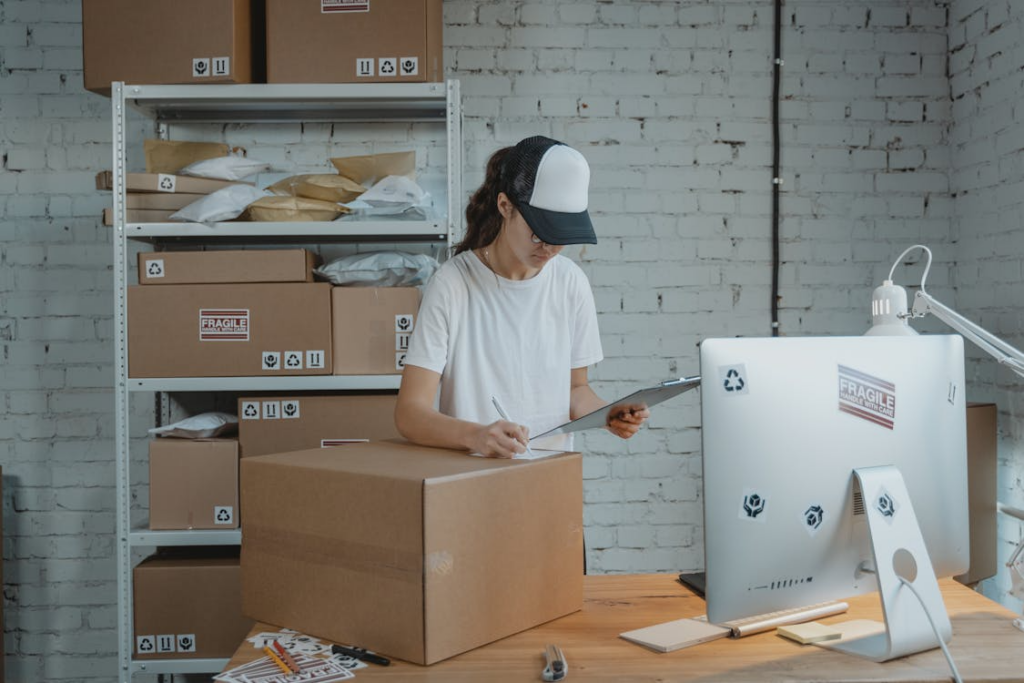person packing and labeling products in a home shipping station, illustrating high-margin micro businesses