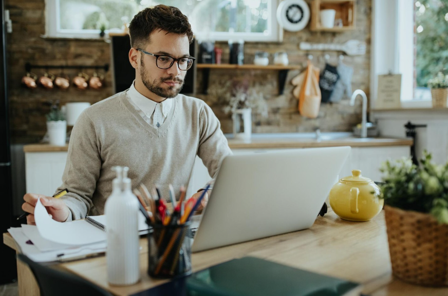 Freelancer reviewing client work on a laptop for high-value freelance income