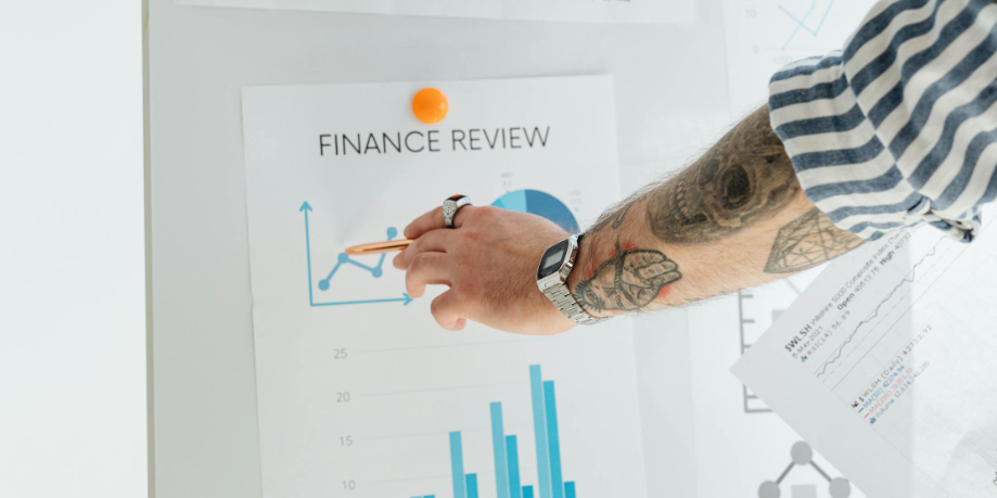 Person reviewing financial growth charts for a financial flywheel strategy