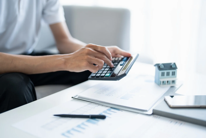 Person planning finances while building assets, while paying down debt