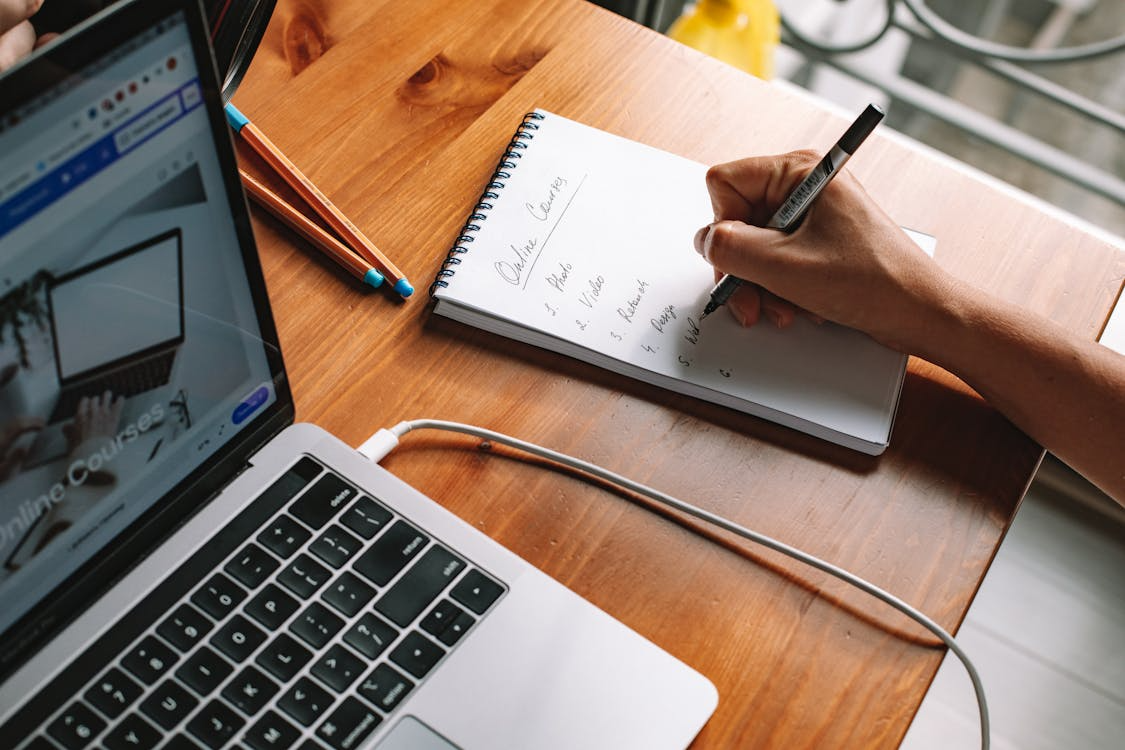 Person planning an online course for digital products passive income